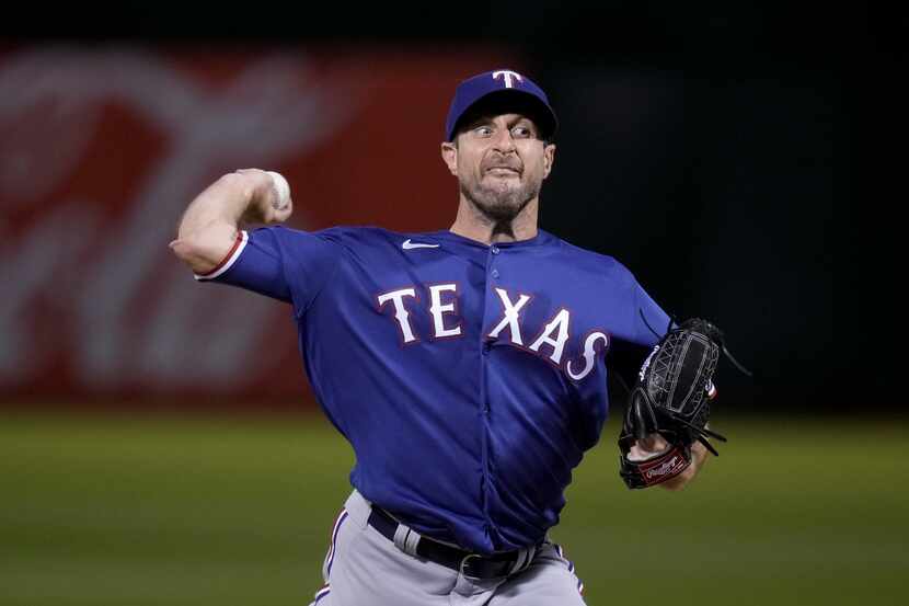 Texas Rangers pitcher Max Scherzer throws to an Oakland Athletics batter during the sixth...