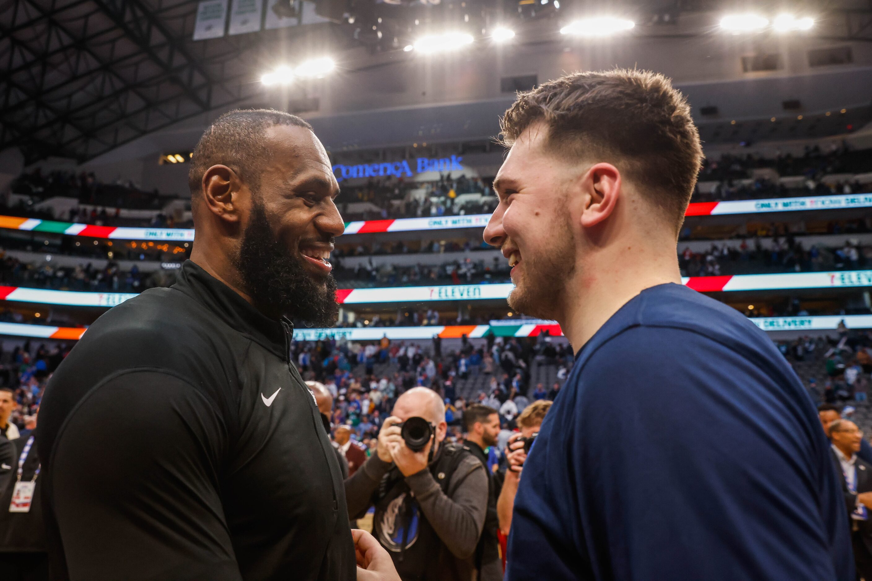 Los Angeles Lakers forward LeBron James (6) talks with Dallas Mavericks guard Luka Doncic...