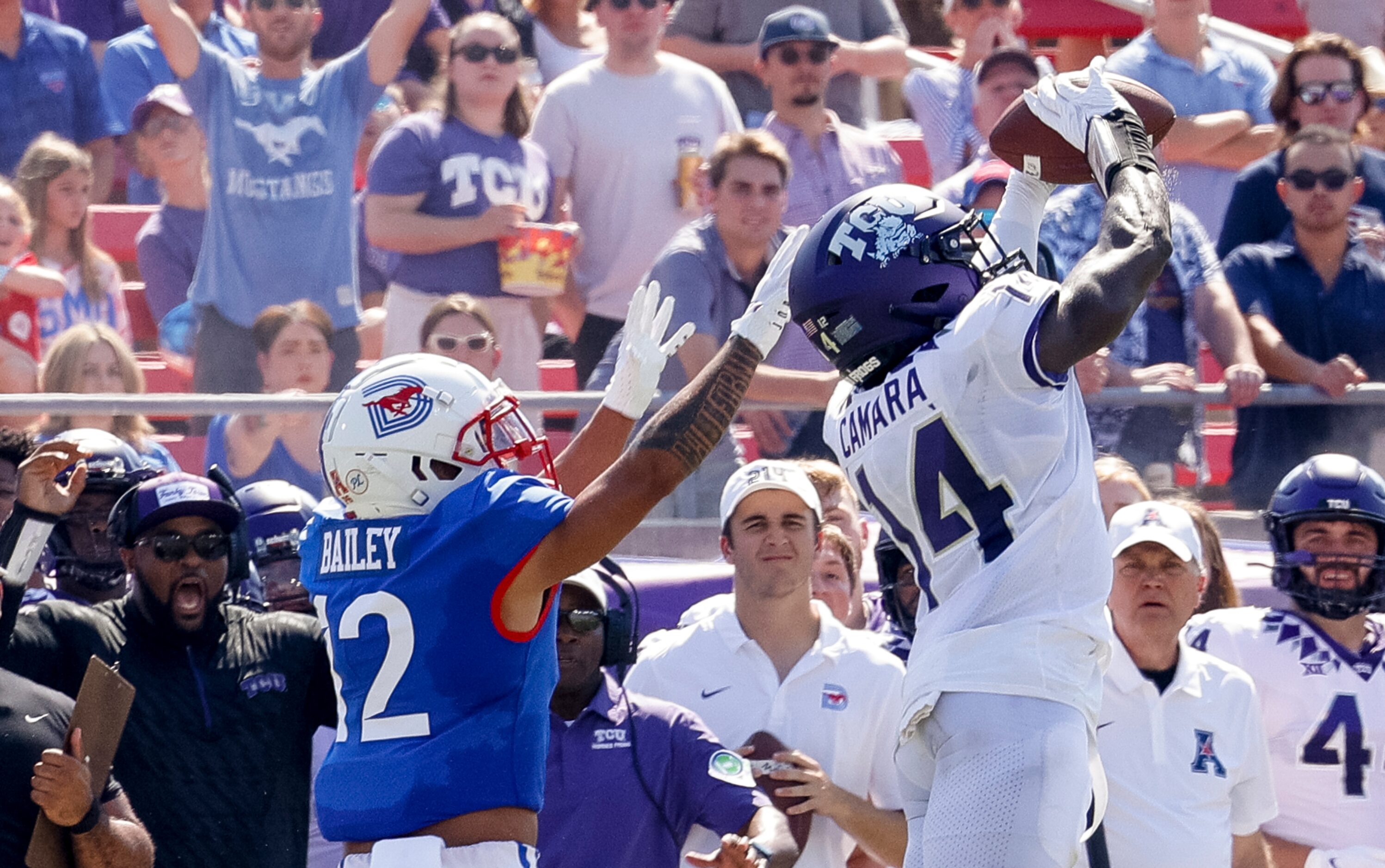 TCU safety Abraham Camara (14) intercepts a pass from SMU quarterback Tanner Mordecai (8)...