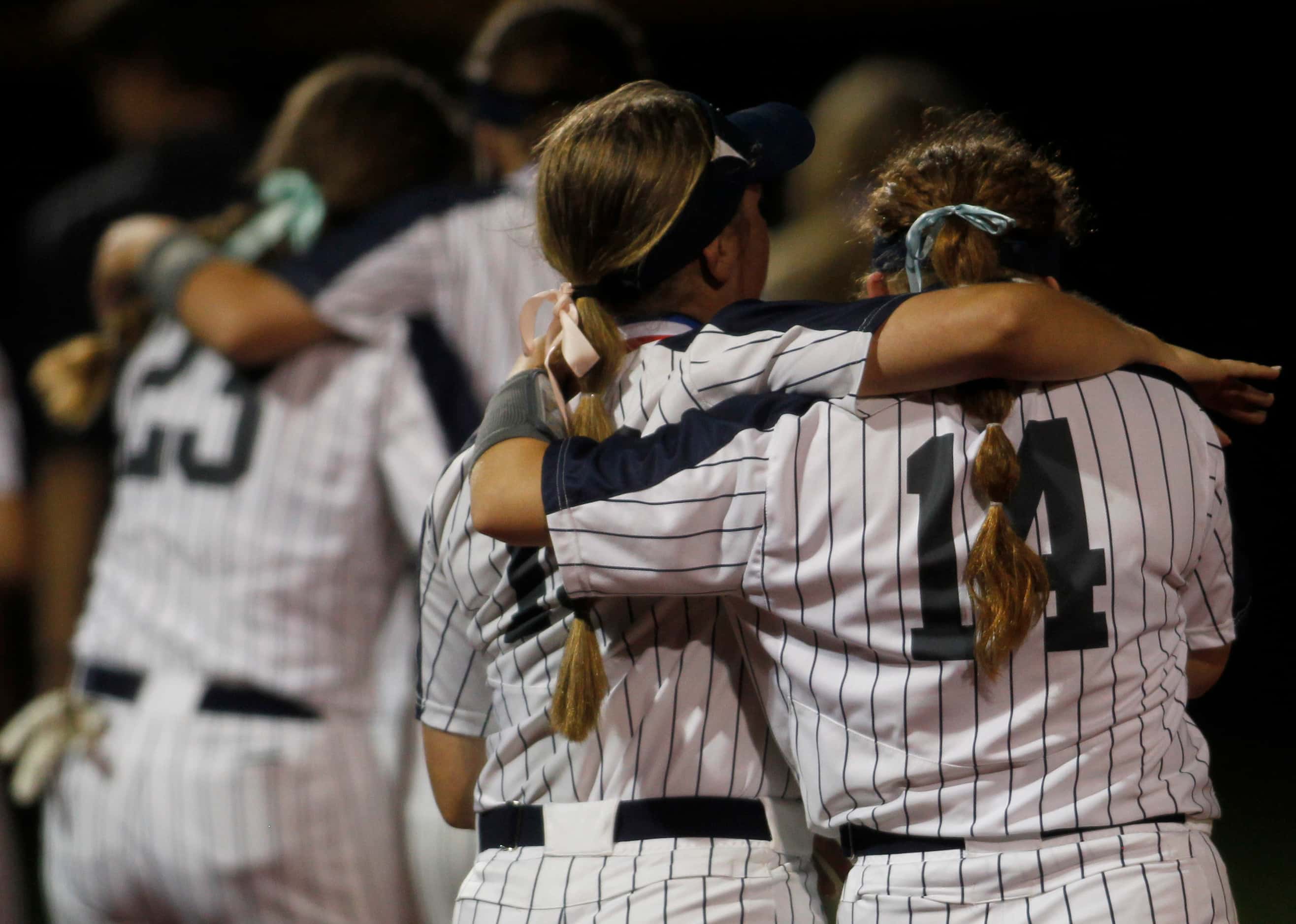 Flower Mound players console one another following their 2-0 loss to Deer Park. The two...