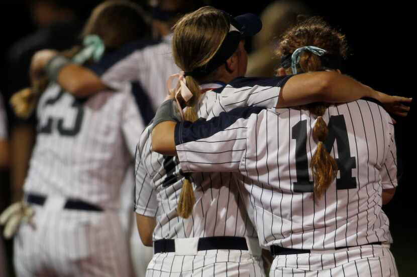 Flower Mound players console one another following their 2-0 loss to Deer Park. The two...