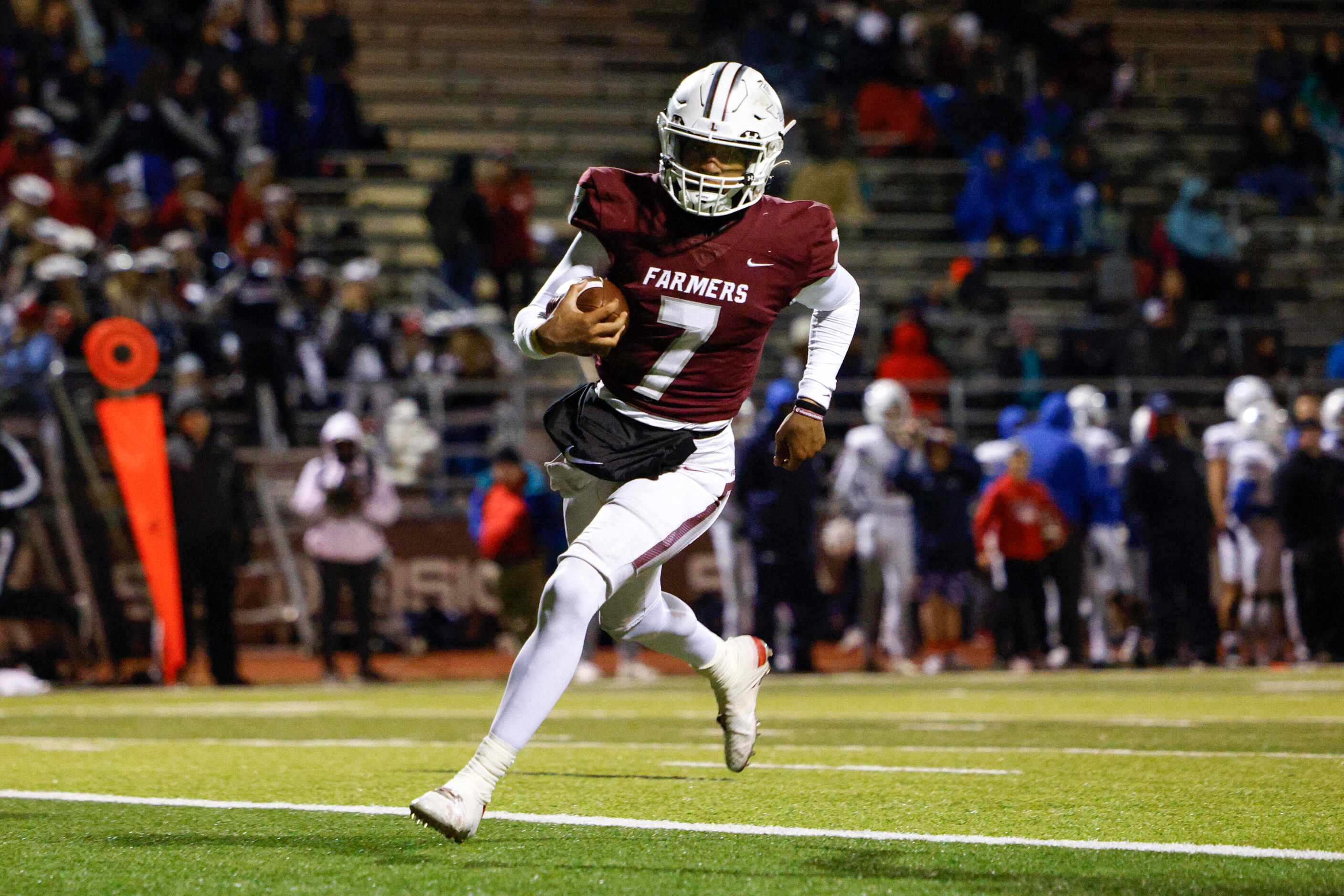 Lewisville quarterback Ethan Terrell (7) strides into the end zone for a touchdown during...