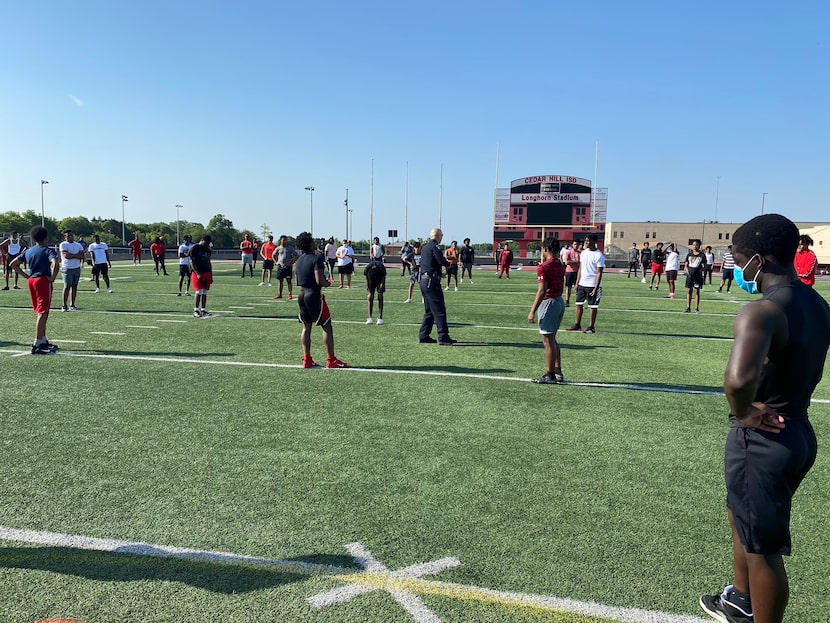 Cedar Hill Chief of Police Ely Reyes speaks to the Cedar Hill football team about racial...