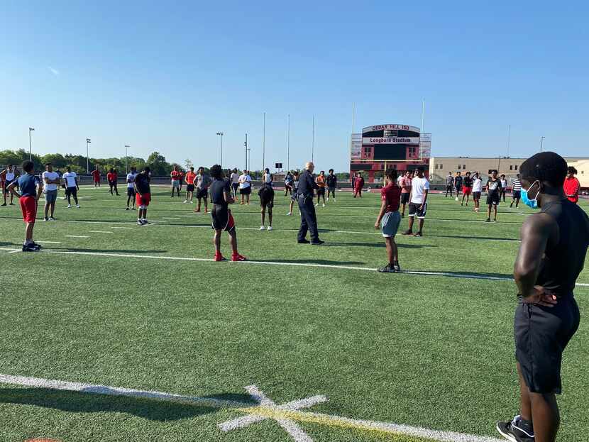 Cedar Hill Chief of Police Ely Reyes speaks to the Cedar Hill football team about racial...