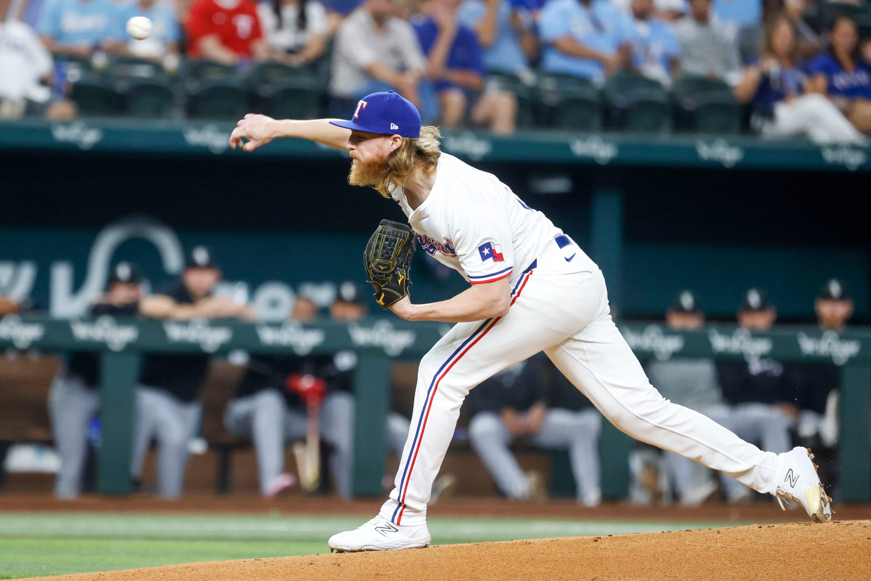 Texas Rangers starting pitcher Jon Gray throws during the first inning of a baseball game...