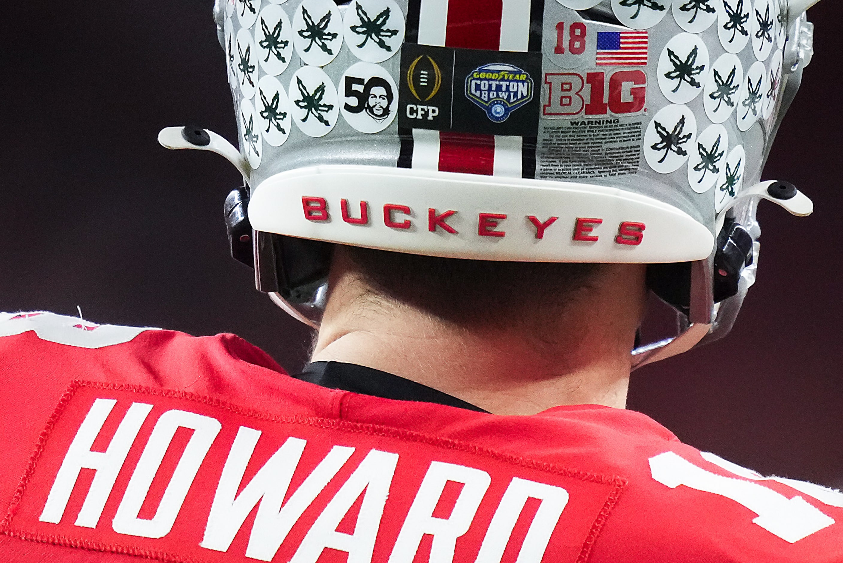 The Cotton Bowl and CFP logos are seen on the helmet of Ohio State quarterback Will Howard...