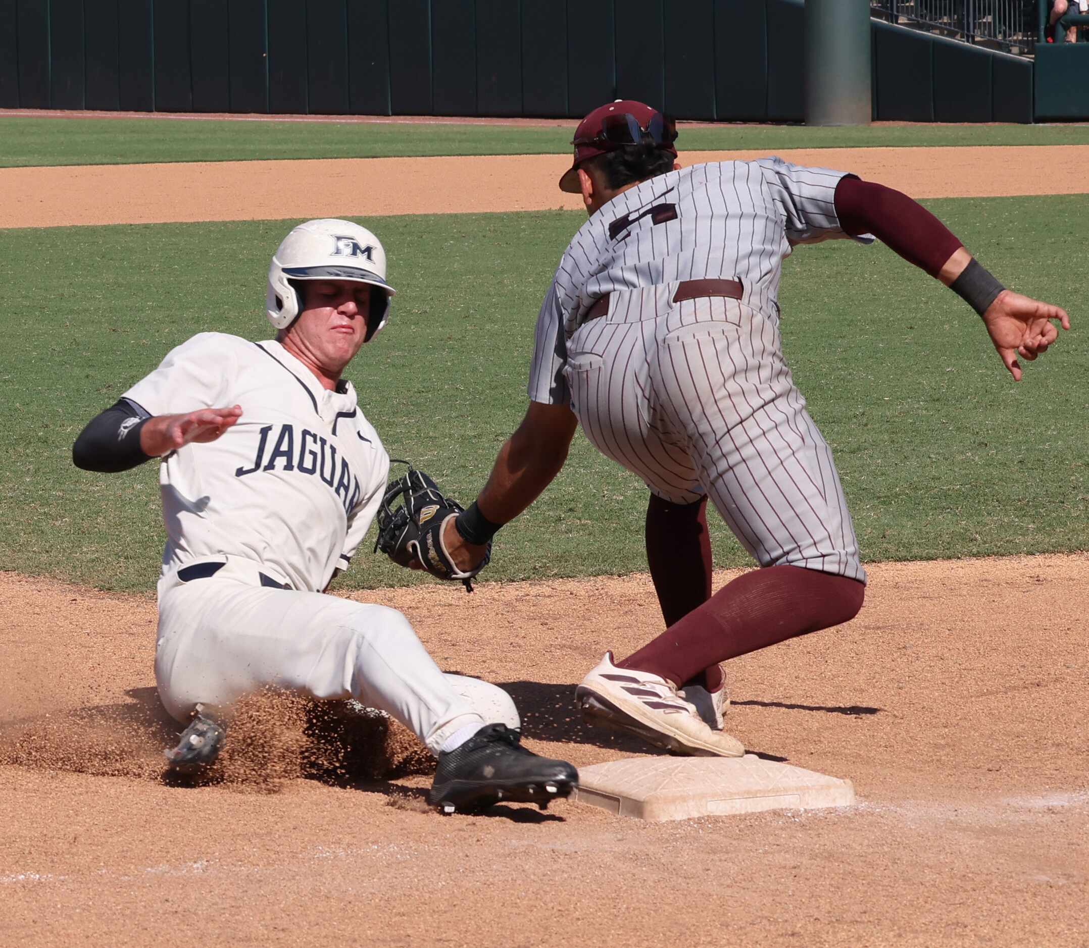 Flower Mound outfielder Garrett Wallace (1) was called out on a force by Pearland 3rd...