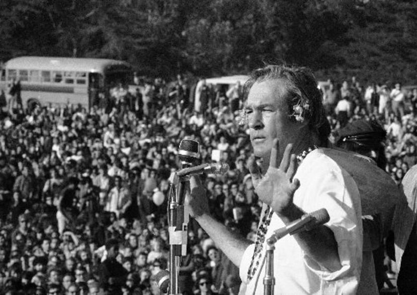 Timothy Leary addresses a crowd of hippies at the "Human Be-In" that he helped organize in...