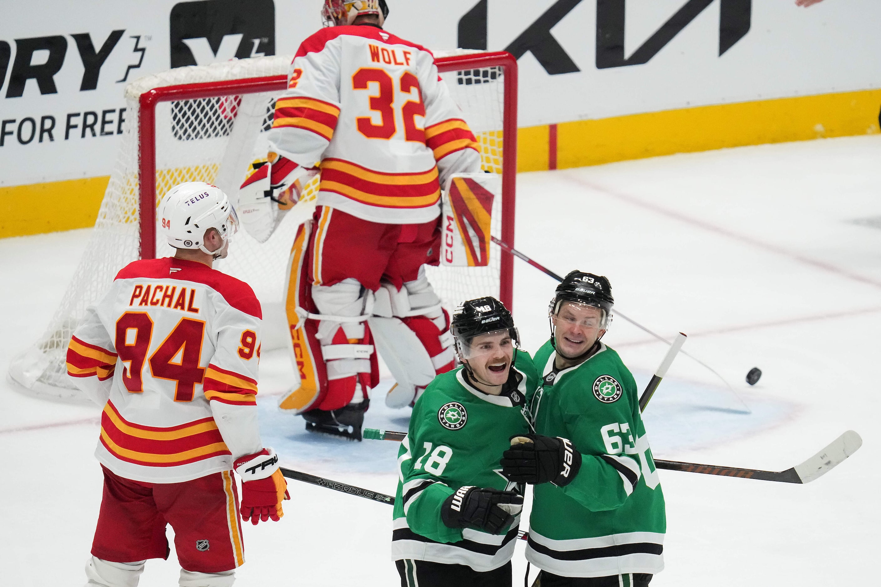 Dallas Stars center Sam Steel (18) celebrates with right wing Evgenii Dadonov (63) after...