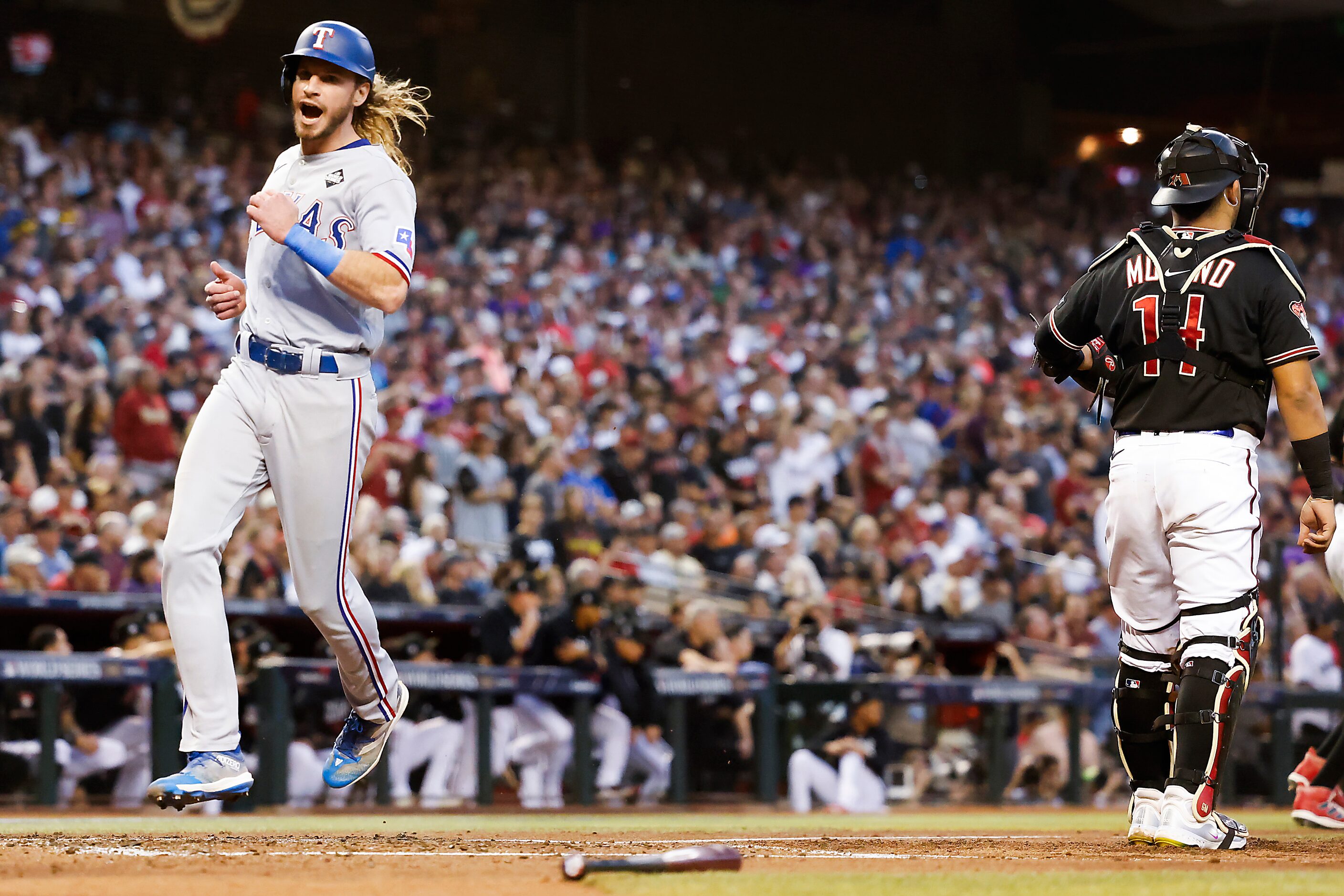 Texas Rangers right fielder Travis Jankowski scores past Arizona Diamondbacks catcher...