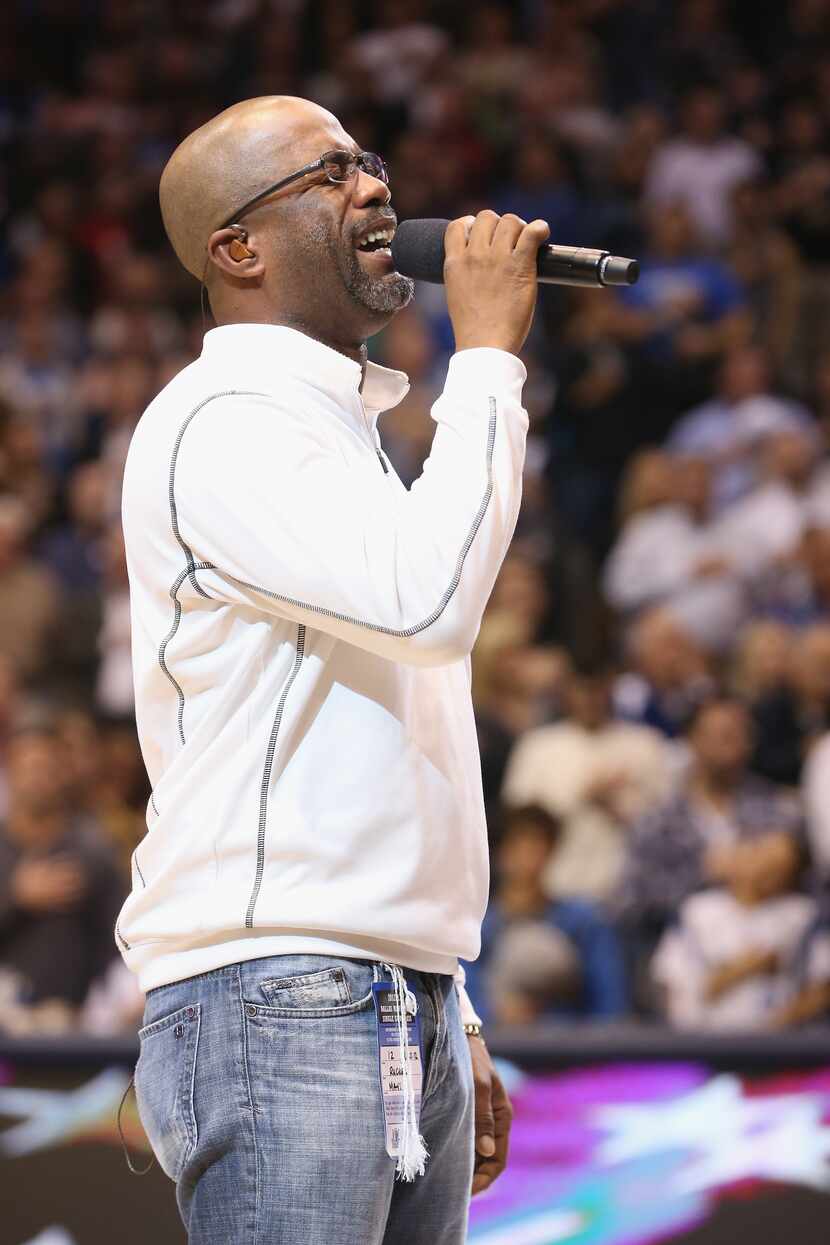 DALLAS, TX - DECEMBER 20:  Musician Darius Rucker performs the national anthem before a game...