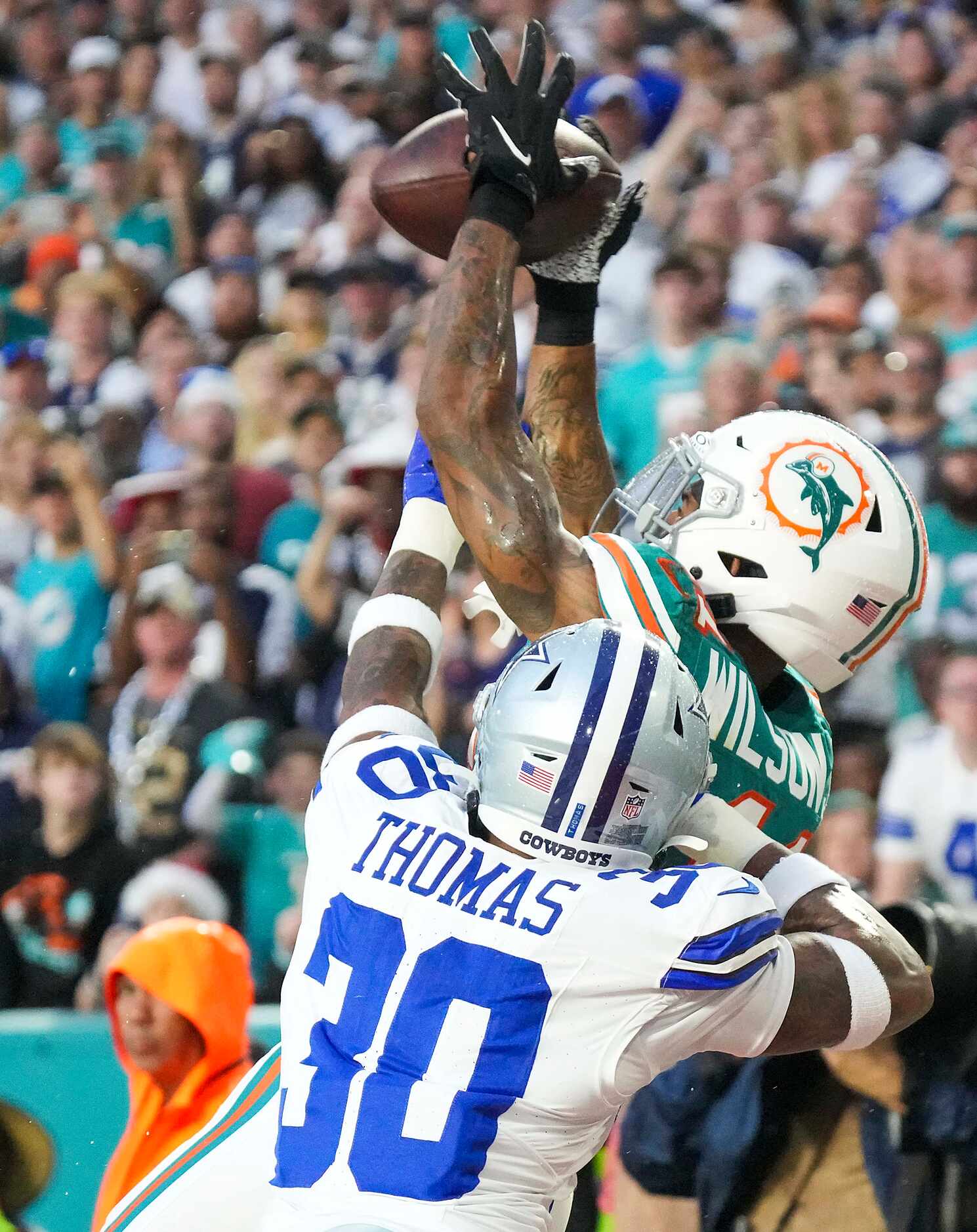 Dallas Cowboys safety Juanyeh Thomas (30) breaks up a fourth down pass to Miami Dolphins...