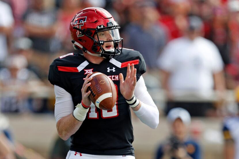 FILE - In this Saturday, Sept. 29, 2018, file photo, Texas Tech's Alan Bowman (10) drops...