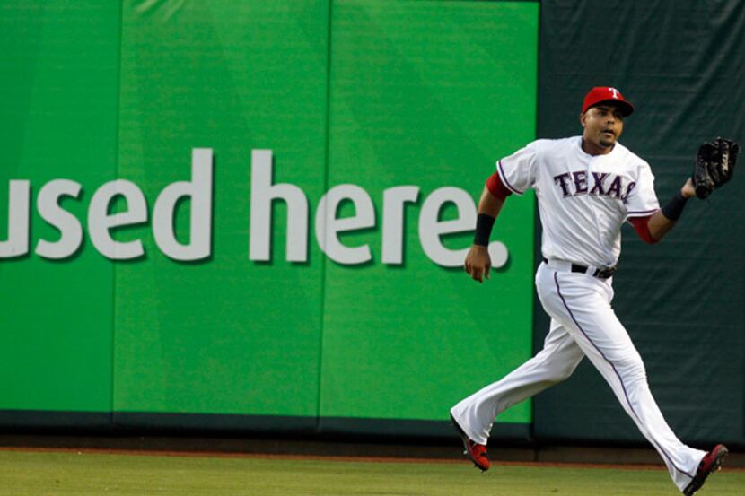 Nelson Cruz catches a fly ball during his last game at Rangers Ballpark in Arlington.