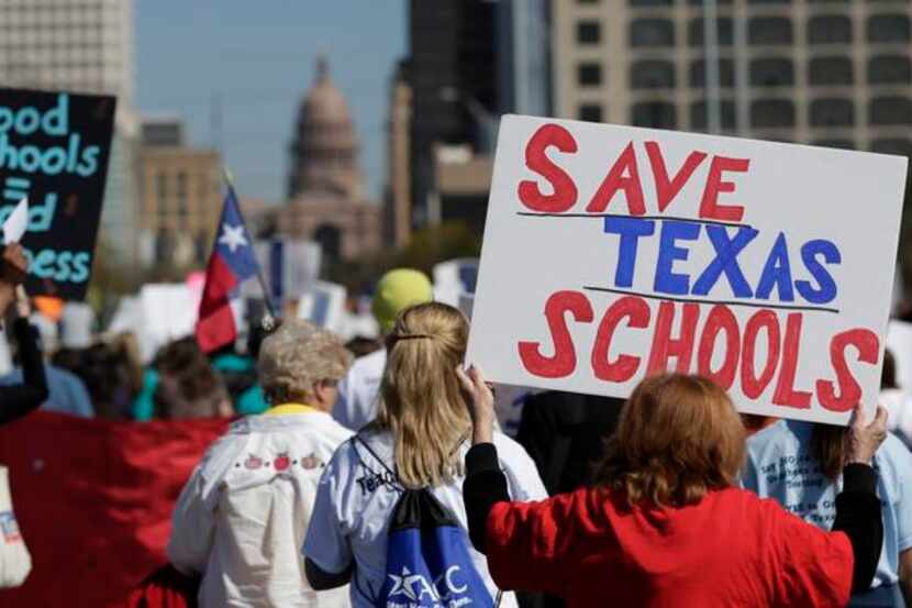 Teachers, students, parents and school administrators marched up Congress Avenue in Austin...