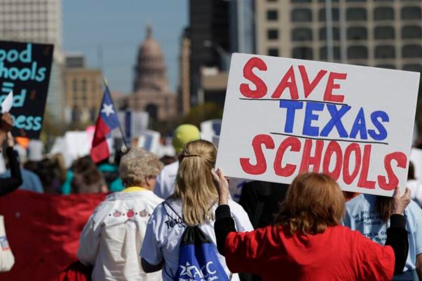 Teachers, students, parents and school administrators marched up Congress Avenue in Austin...