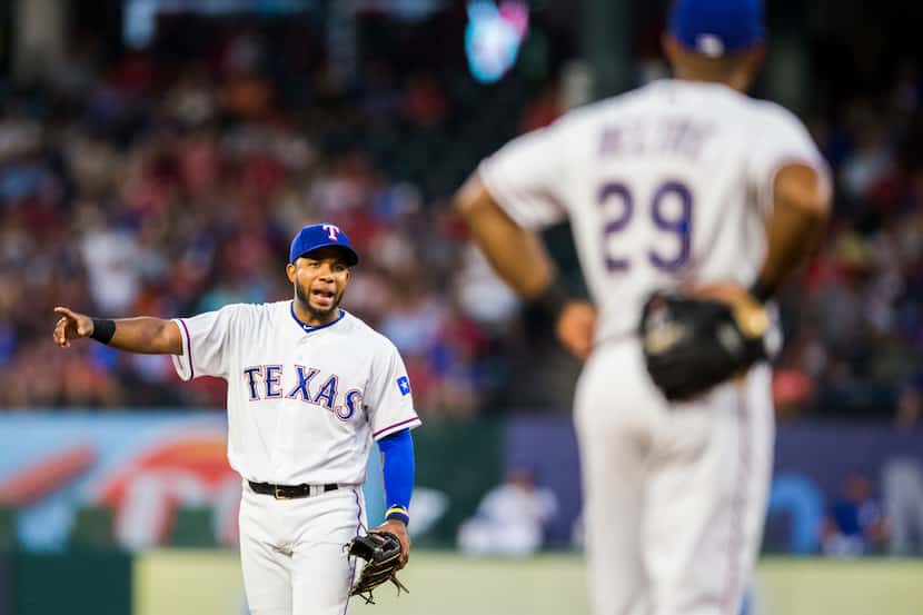 Texas Rangers shortstop Elvis Andrus (1) talks to third baseman Adrian Beltre (29) during...