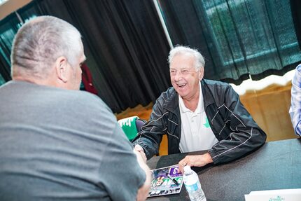 Gordon Jago signs autographs at the Dallas Sidekicks game.