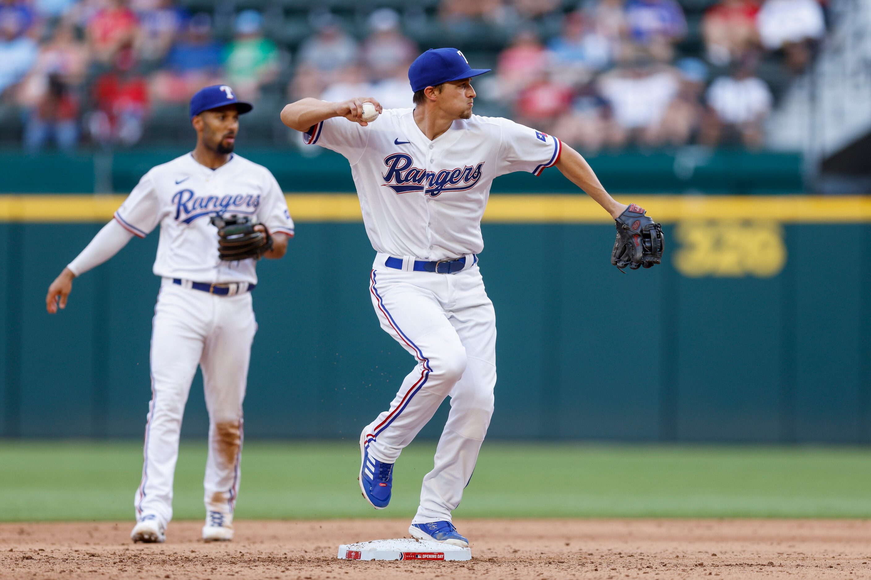 Texas Rangers shortstop Corey Seager (5) throws to first for a double play during the...