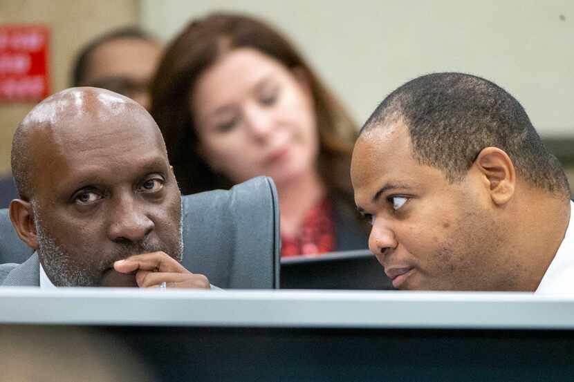 Dallas City Manager T.C. Broadnax (left) listens to Mayor Eric Johnson during a City Council...
