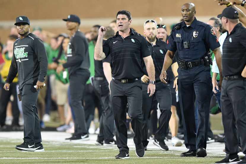 North Texas head coach Seth Littrell pumps his fist after his team defeats their opponent,...
