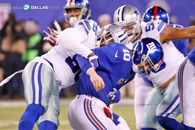 Dallas Cowboys defensive end Benson Mayowa (93) forces a fumble by New York Giants...
