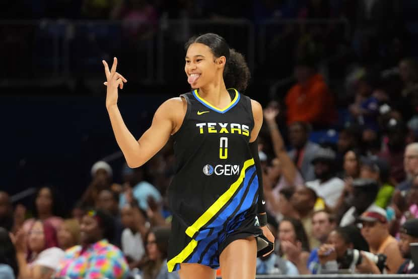 Dallas Wings forward Satou Sabally reacts to scoring a 3-point basket during the second half...