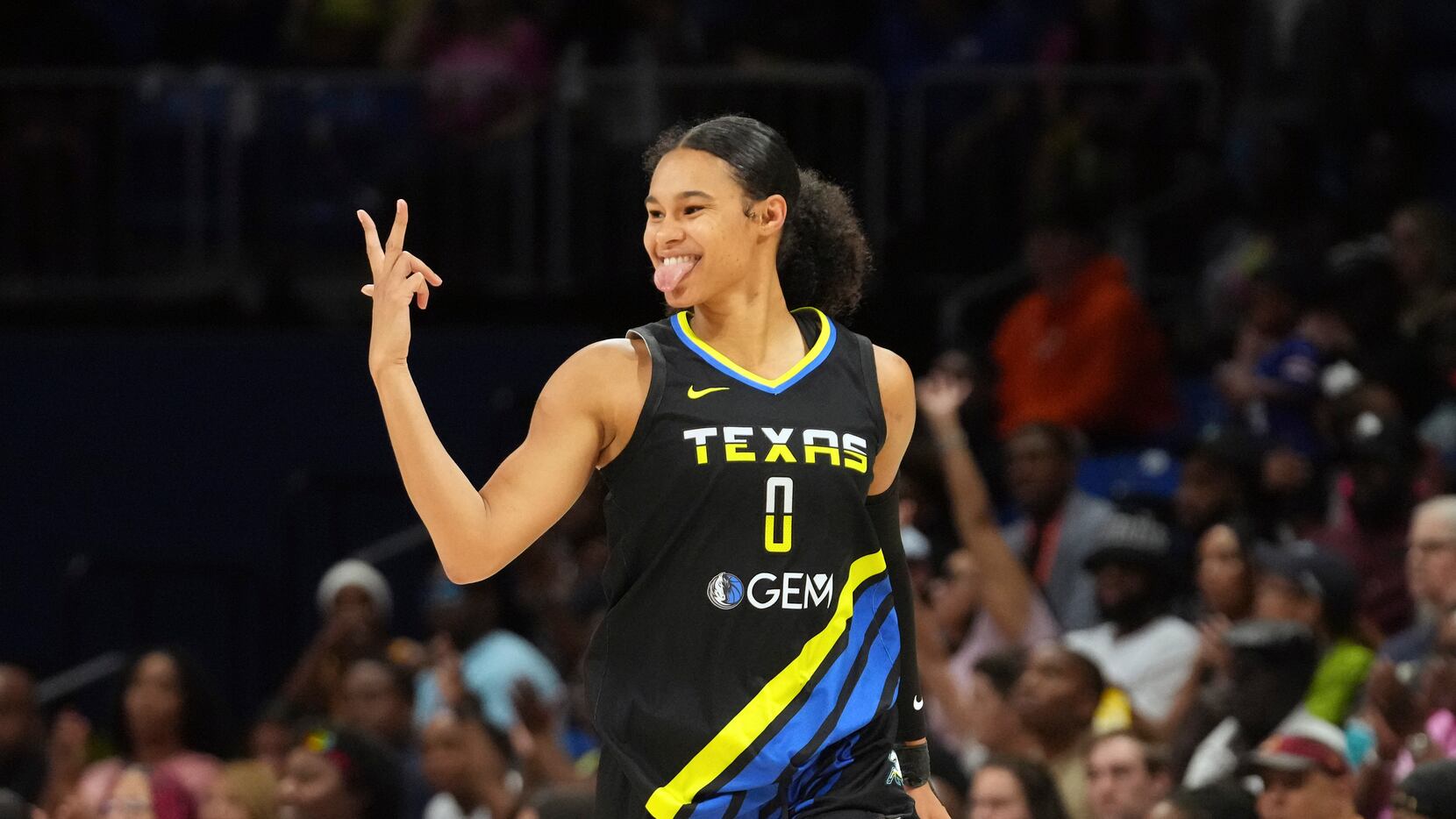 Dallas Wings forward Satou Sabally reacts to scoring a 3-point basket during the second half...