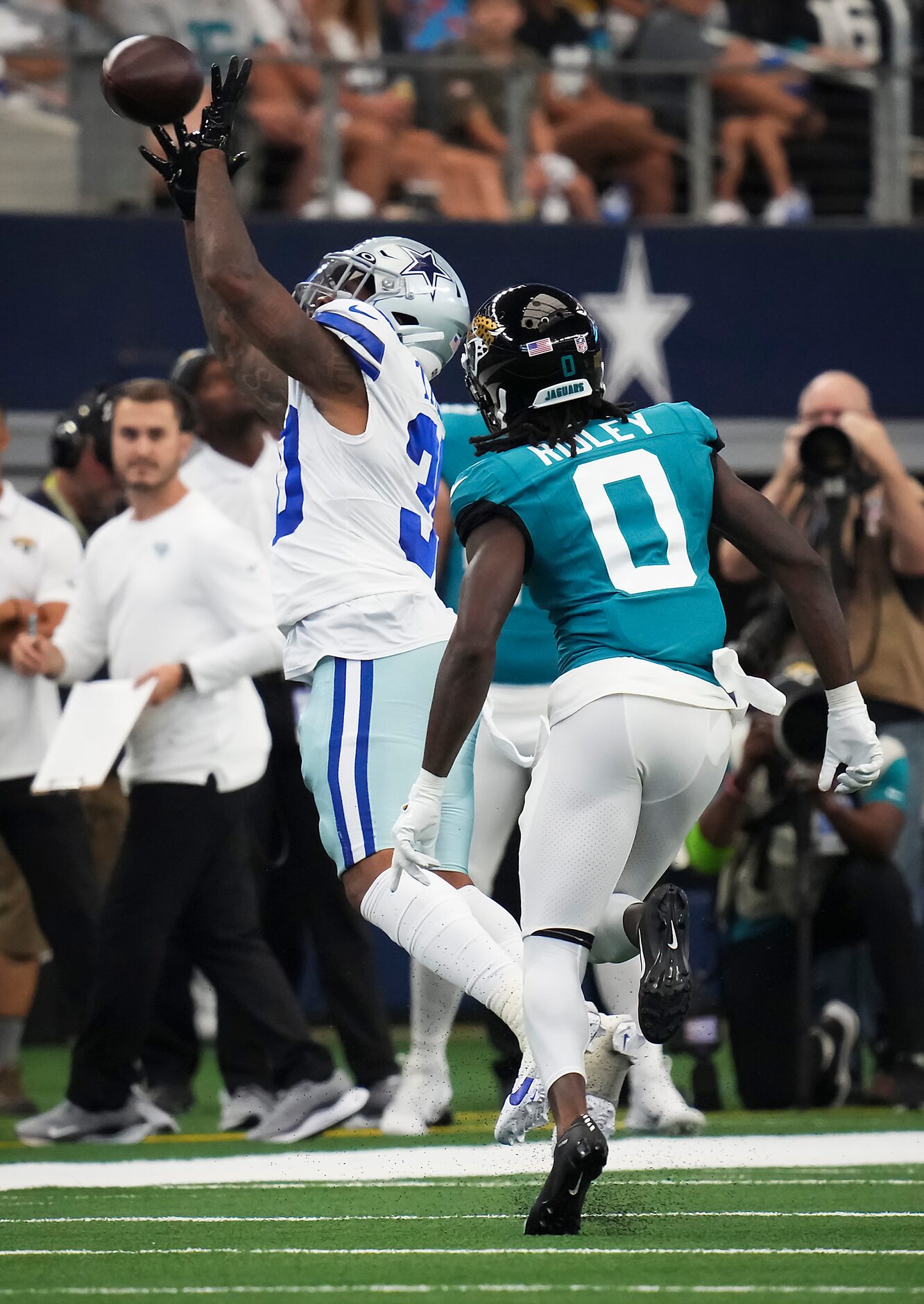 Dallas Cowboys safety Juanyeh Thomas (30) intercepts a pass intended for Jacksonville...