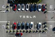 Tesla vehicles line a parking lot at the company's Fremont, Calif., factory, on Sept. 18, 2023.
