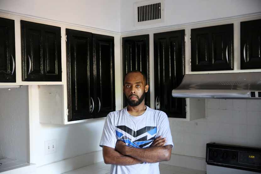 Robin Bobo stands in the kitchen of his Richardson condo, which he was able to afford with...