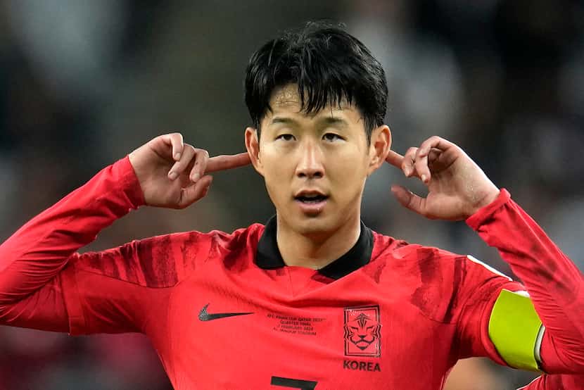 South Korea's Son Heung-min celebrates after scoring his side's second goal during the Asian...