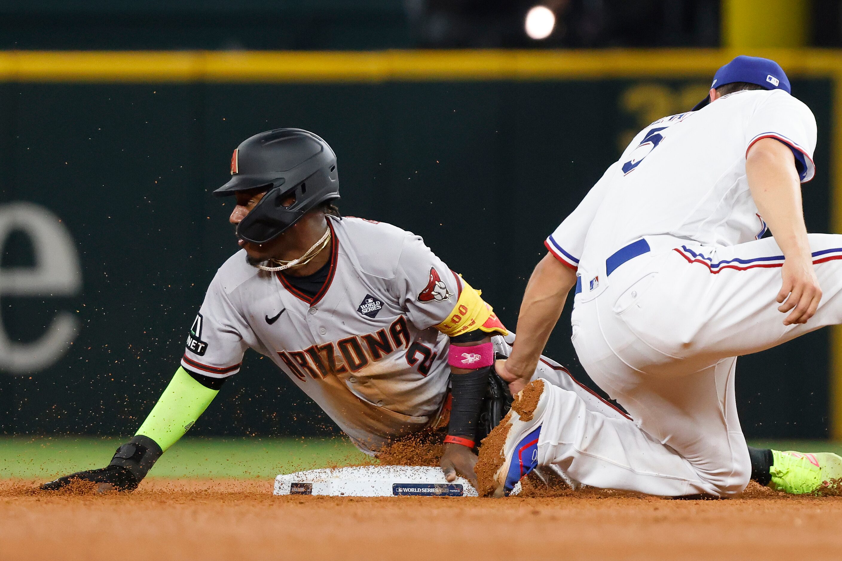 Texas Rangers shortstop Corey Seager's tag is late as Arizona Diamondbacks' Geraldo Perdomo...