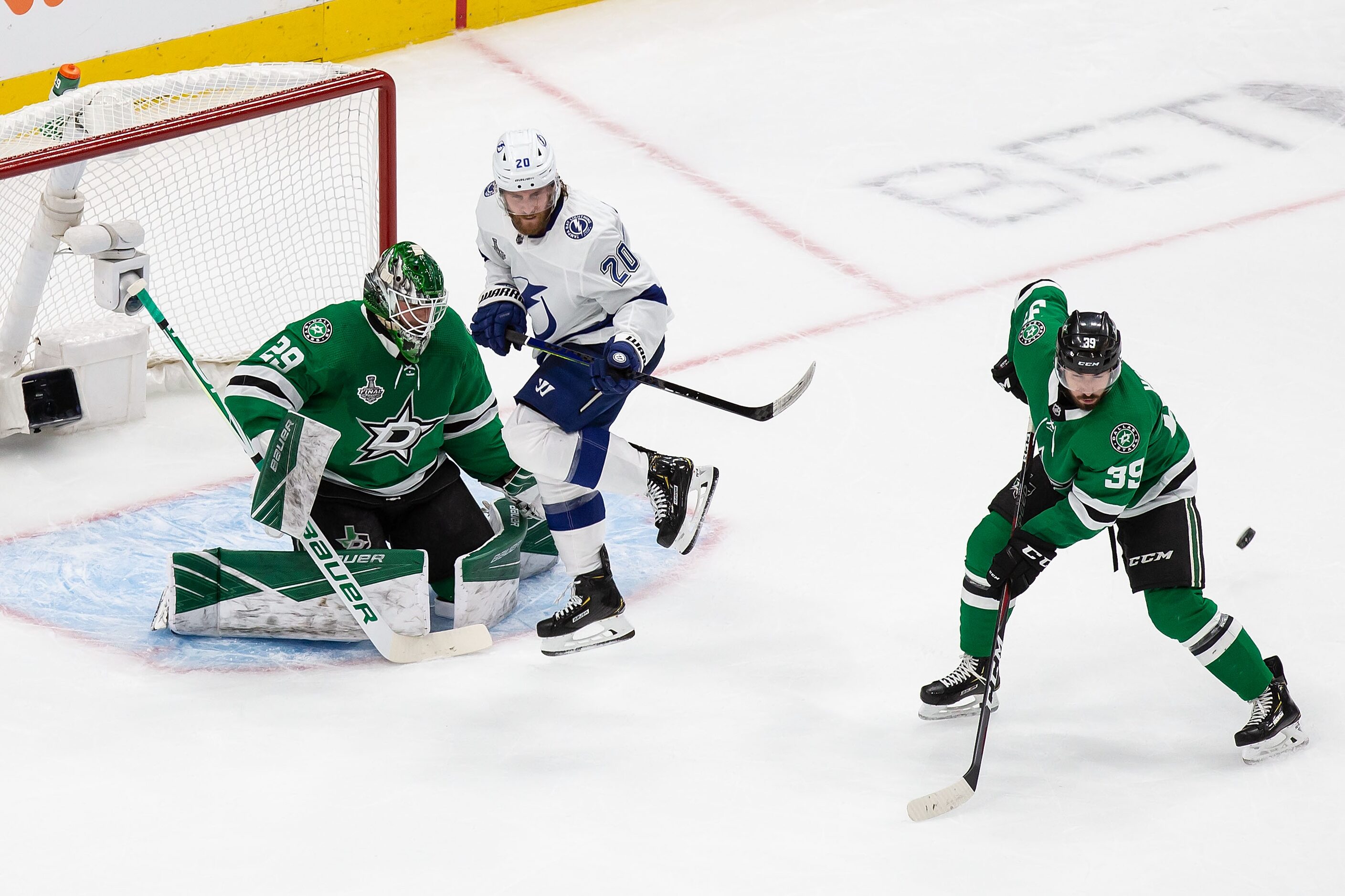 Goaltender Jake Oettinger (29) and Joel Hanley (39) of the Dallas Stars defend against Blake...