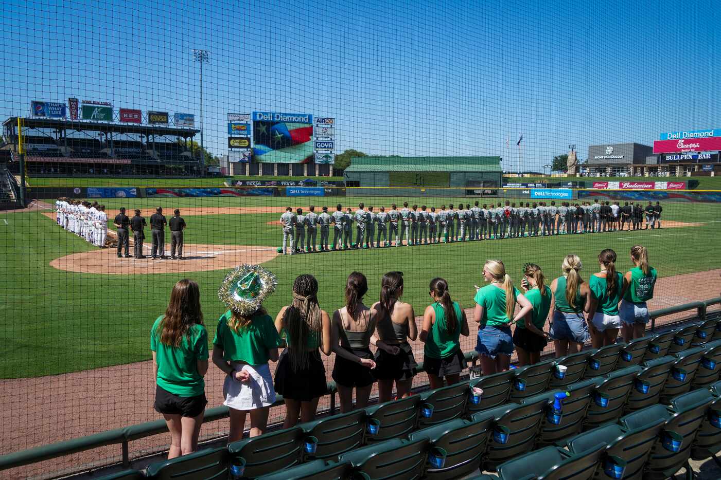 Fort Bend Ridge Point (left) and Southlake Carroll players stand for the national anthem...