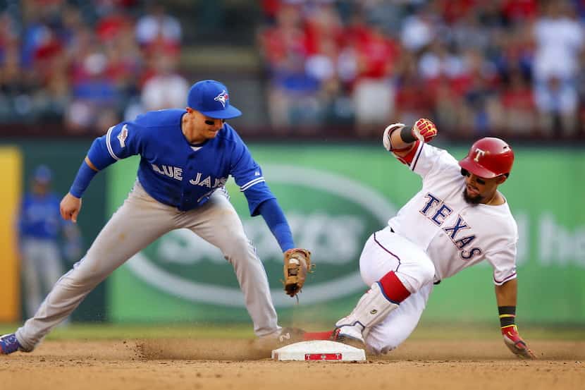 Texas Rangers batter Rougned Odor (12) is safe at second on a seventh inning double as...