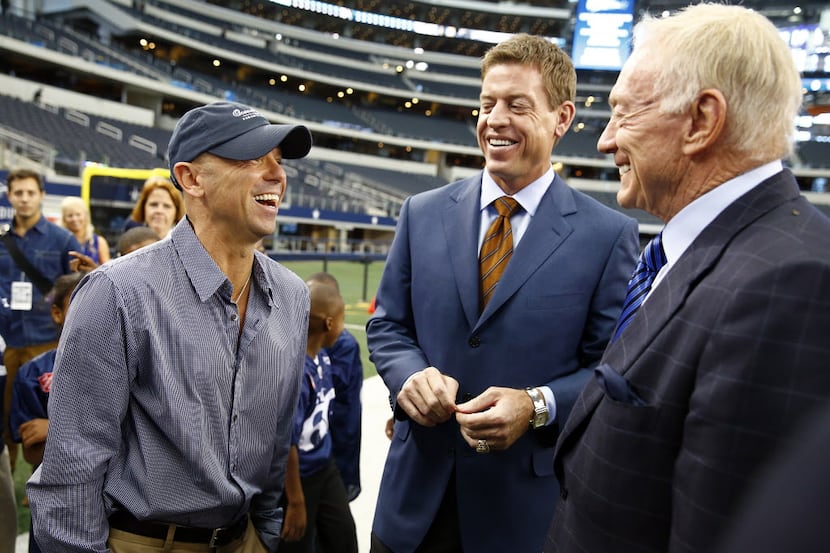 Dallas Cowboys owner Jerry Jones, right, and former Cowboys quarterback Troy Aikman laugh...