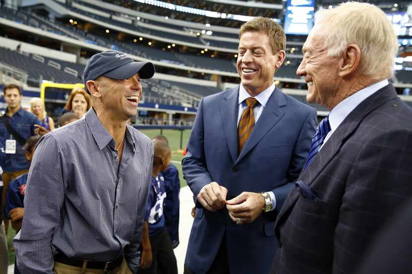 Dallas Cowboys owner Jerry Jones, right, and former Cowboys quarterback Troy Aikman laugh...