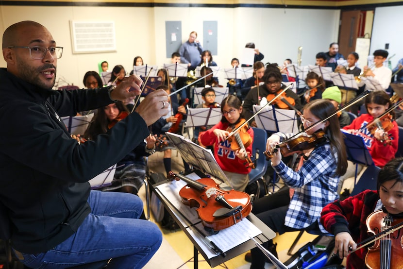 Jorge Milla, site leader DSO's Young Musicians Program leads a combined practice session...