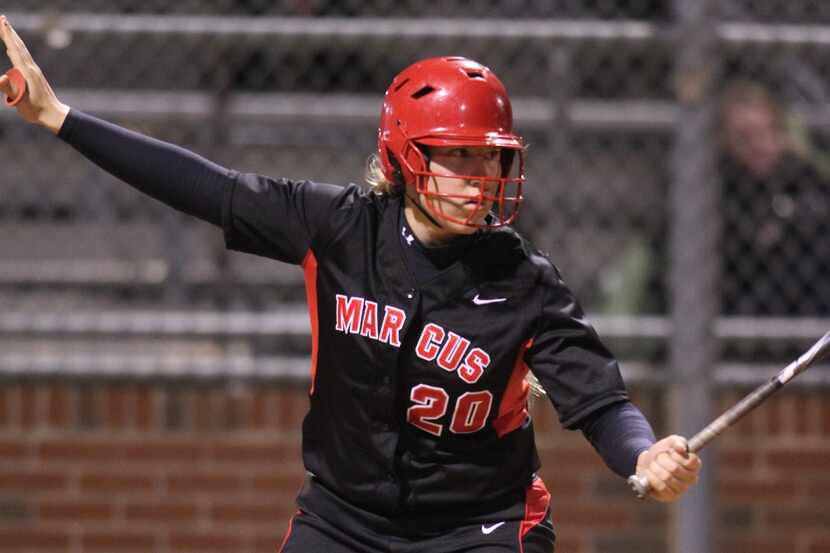 Flower Mound Marcus batter Maddie Heathington (20) asks for time and steps out of the...