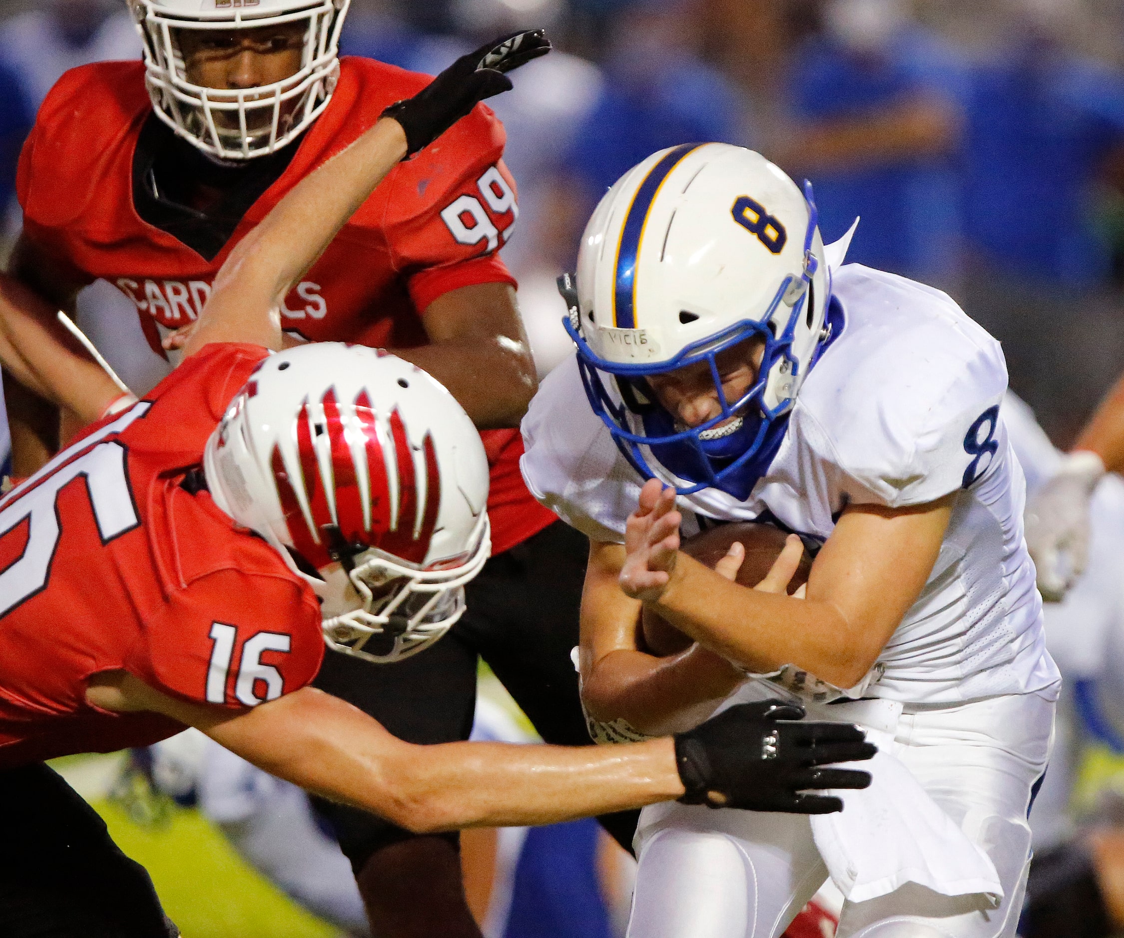 Sunnyvale High School quarterback Max McAda (8) is met by Melissa High School defensive back...