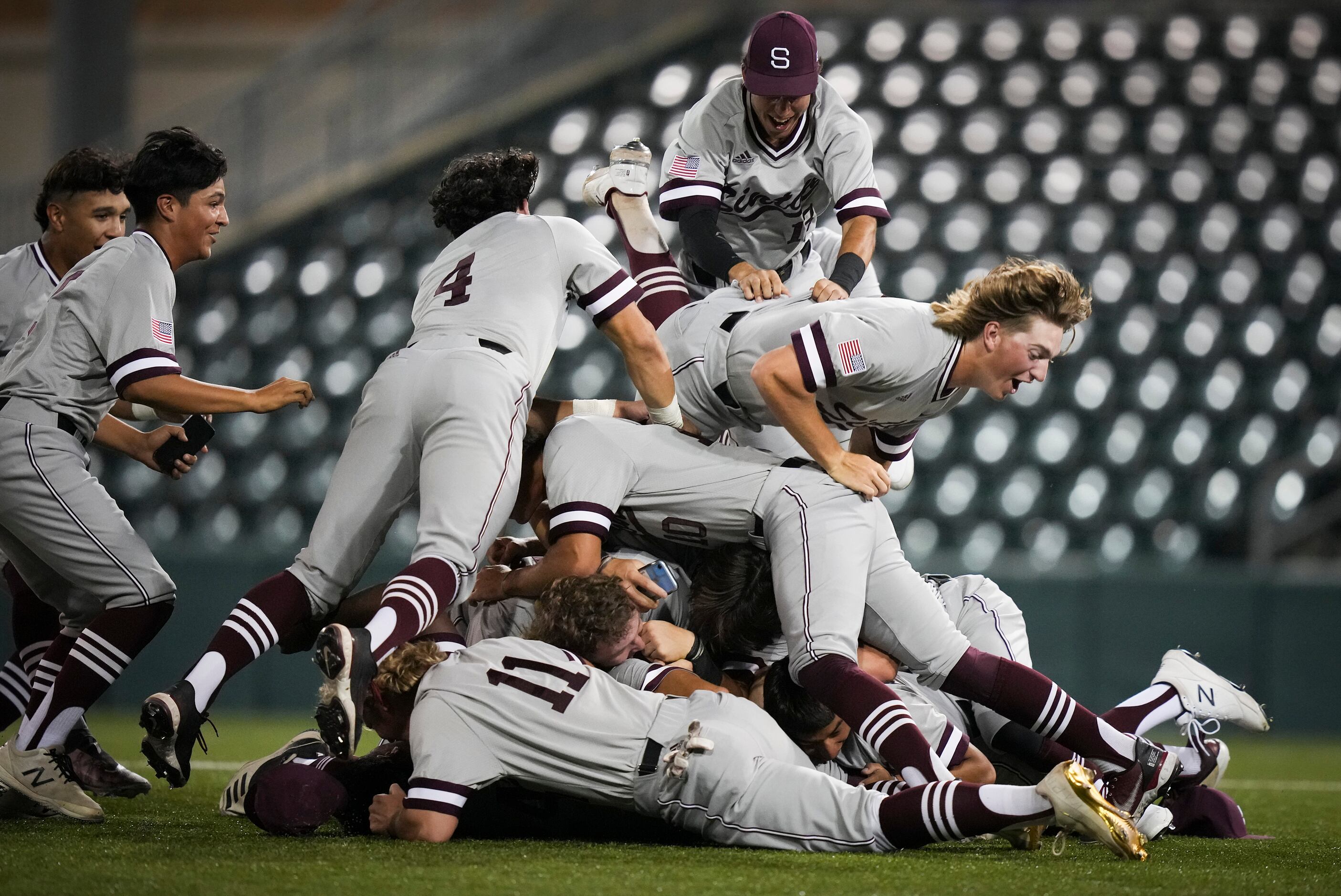 Sinton players celebrate after defeating Argyle 9-0 to win the UIL 4A baseball state...
