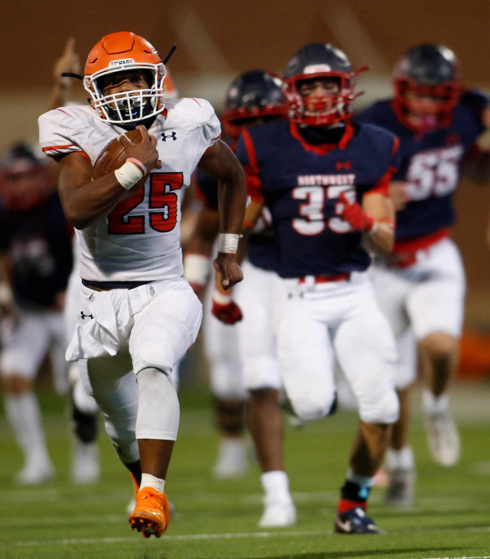 McKinney North running back Jayden Smith (25) is "off to the races" as he leaves several...