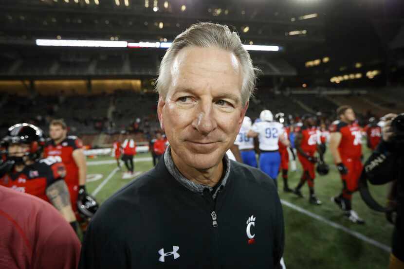 Cincinnati coach Tommy Tuberville walks off the field after the team's NCAA college football...