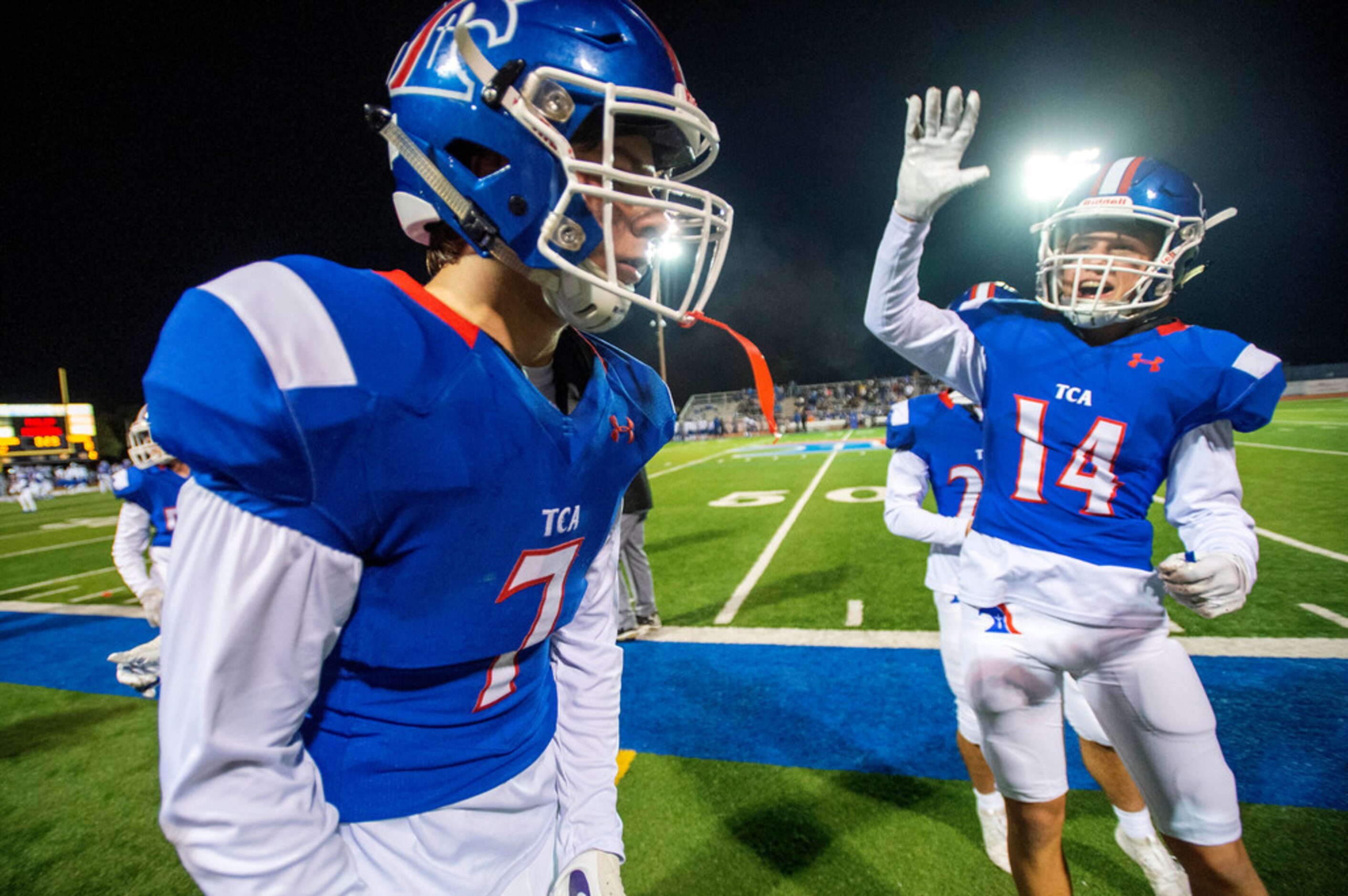 TCA-Addison running back Markus Schumacher (7) is congratulated by wide receiver Charlie...