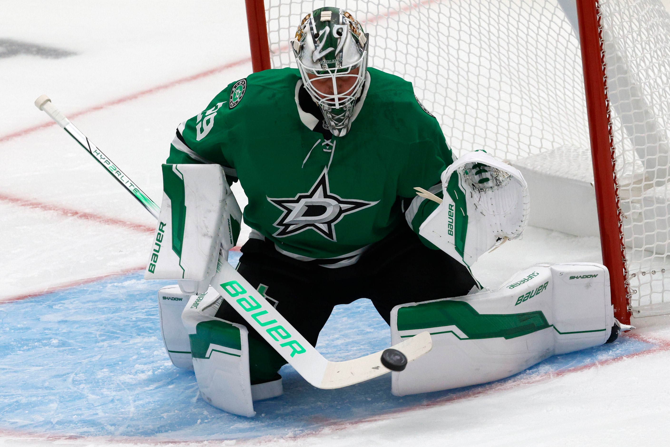 Dallas Stars goaltender Jake Oettinger (29) makes a save against Minnesota Wild during the...