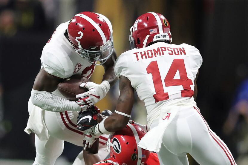 Alabama's Tony Brown intercepts a Nick Fromm pass to Javon Wimms on the opening drive during...