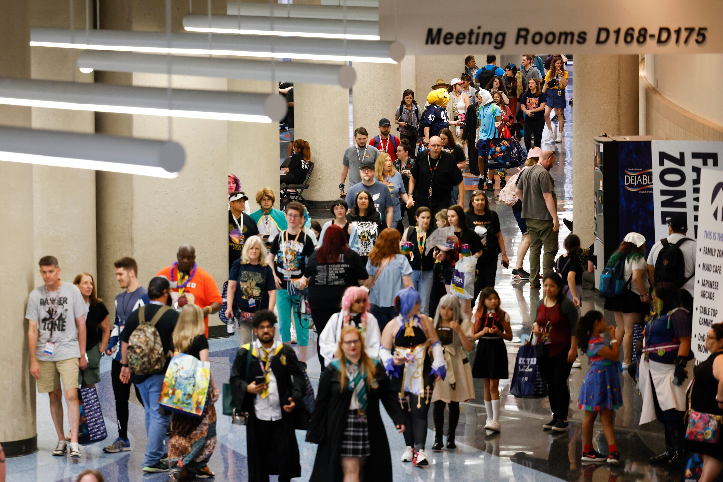 People walk inside the hallway during Fan Expo Dallas on Friday, June 9, 2023, at Kay Bailey...