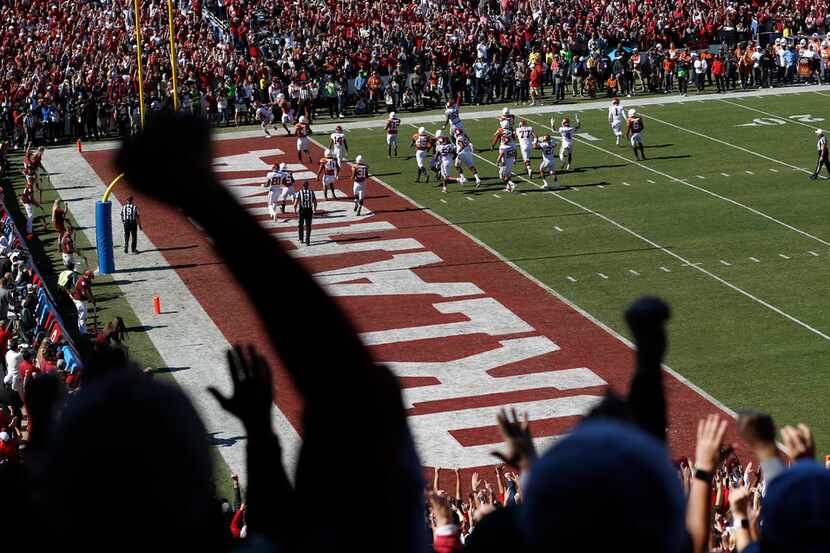 Oklahoma Sooners fans celebrate as Oklahoma Sooners scores on their opening drive against...