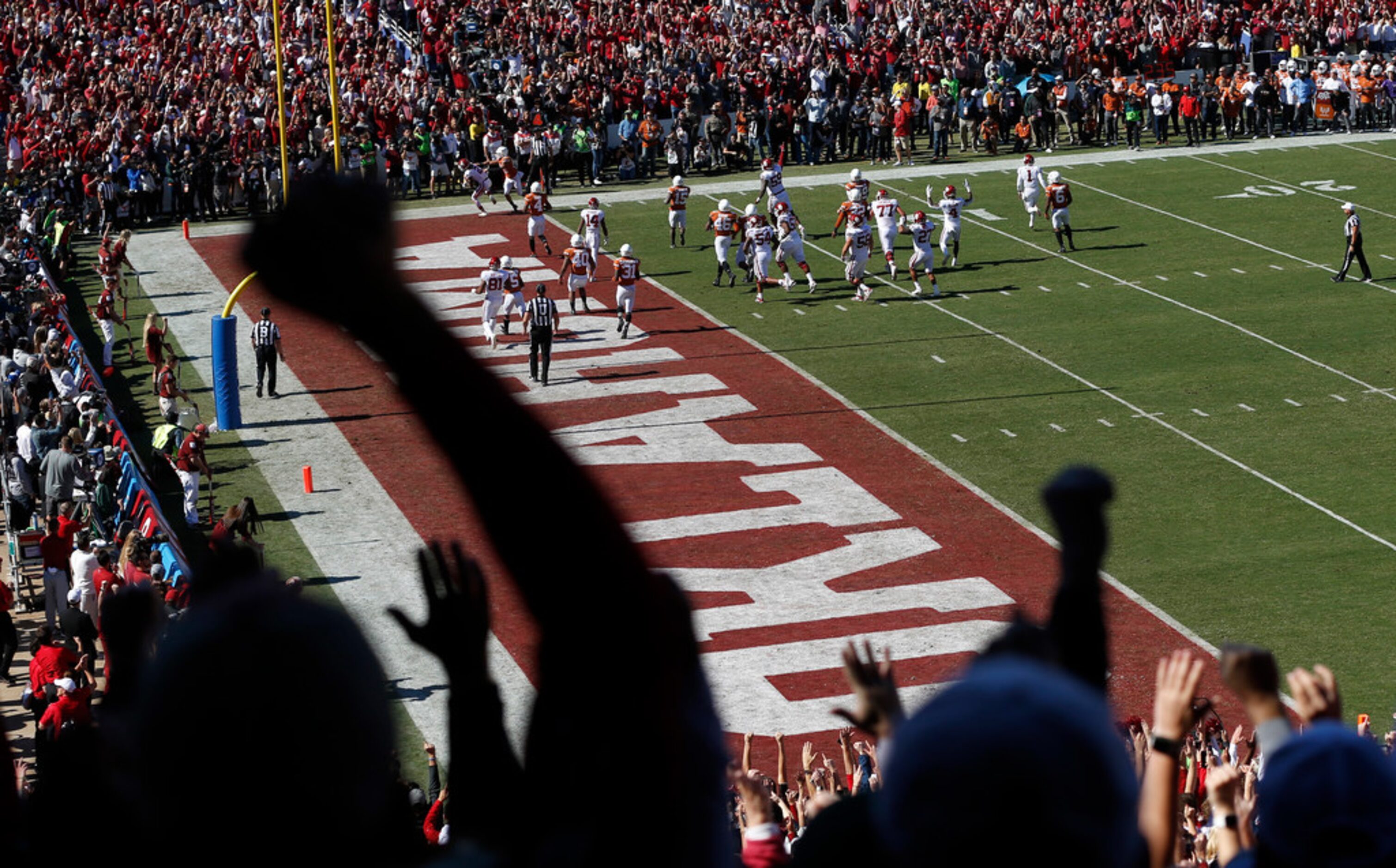 Oklahoma Sooners fans celebrate as Oklahoma Sooners scores on their opening drive against...